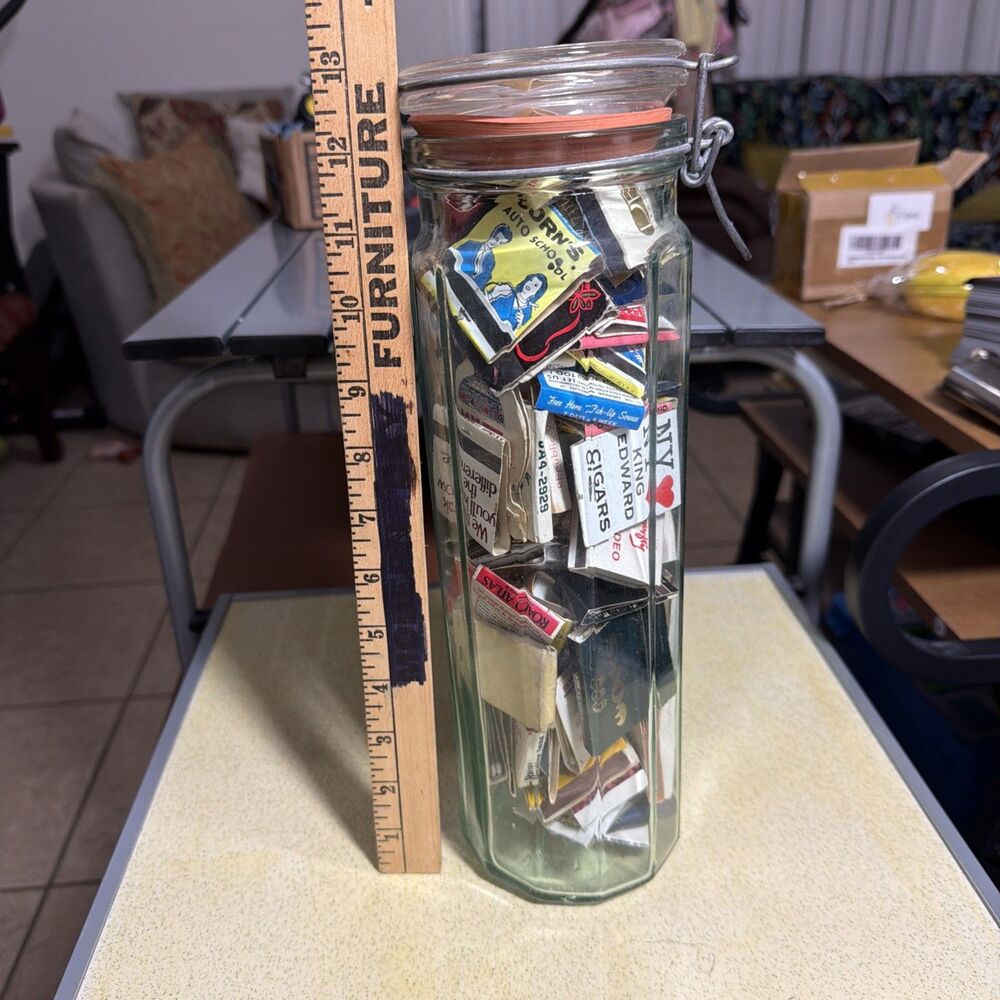 Jar Filled With Vintage Matchbooks 13 Inches Tall 3.5 Inches Wide.